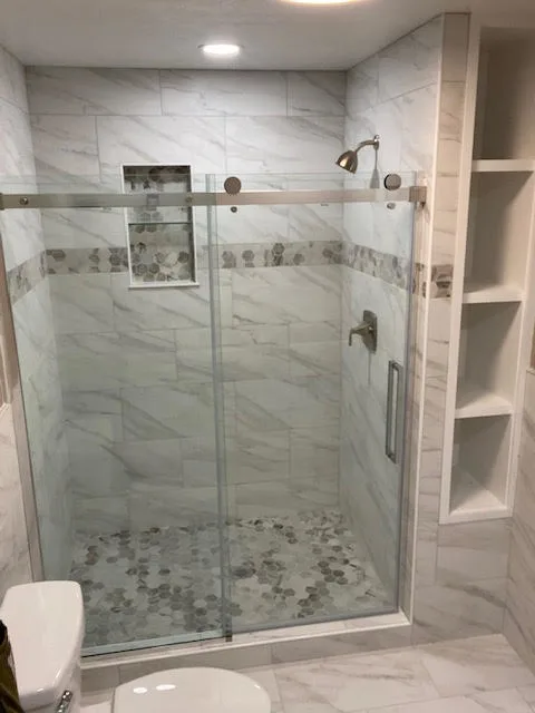 Renovated bathroom with new tile and fixtures