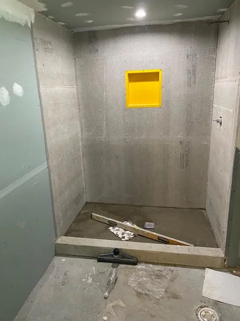 Small bathroom before remodeling, in its original dated condition