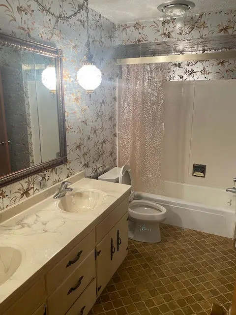 Bathroom before remodeling, original dated condition