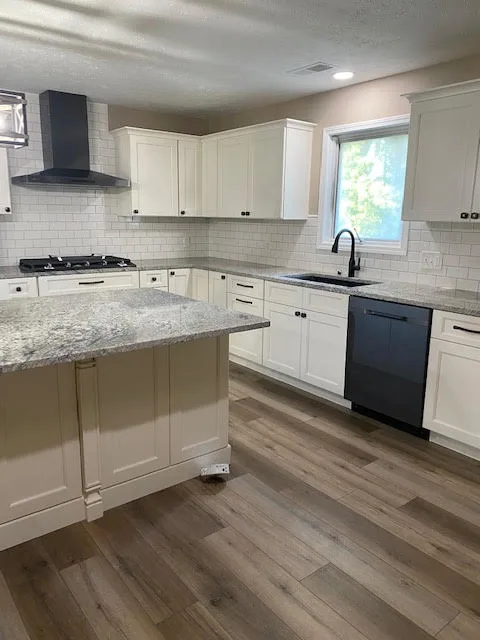 Remodeled kitchen with new cabinetry and countertops
