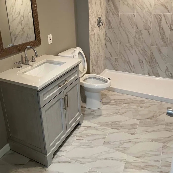 Finished bathroom with tile work and updated fixtures