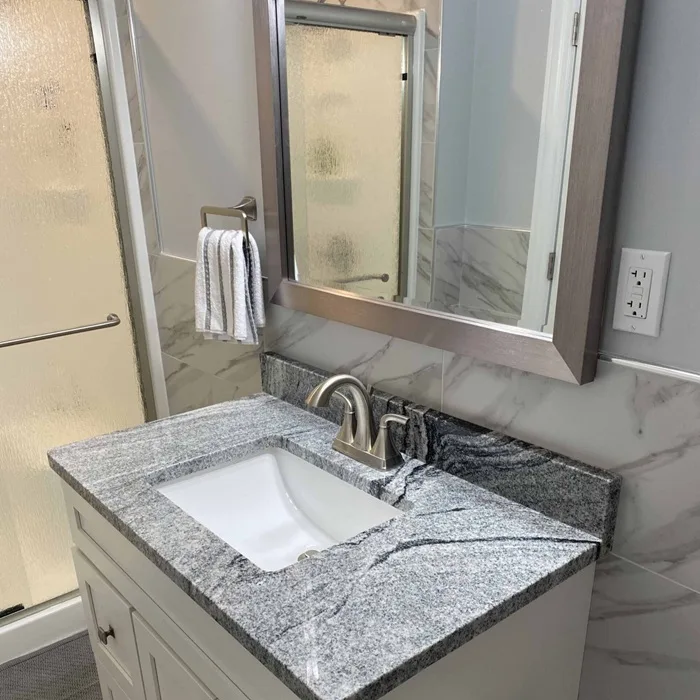 Remodeled bathroom vanity and sink with a new countertop